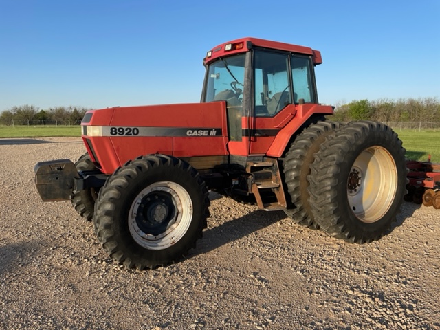 A Tractor Parked On A Dirt Field