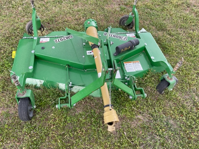 a large machine in a field of green grass