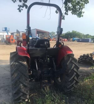 A Tractor Parked In The Grass