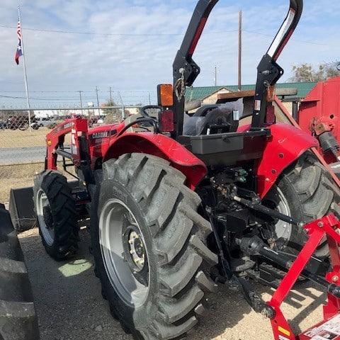 A Large Tractor Parked In A Parking Lot
