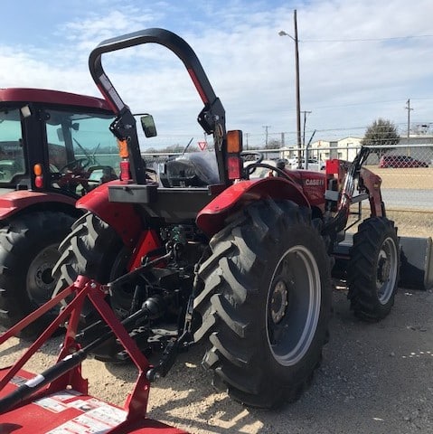 A Tractor In A Parking Lot