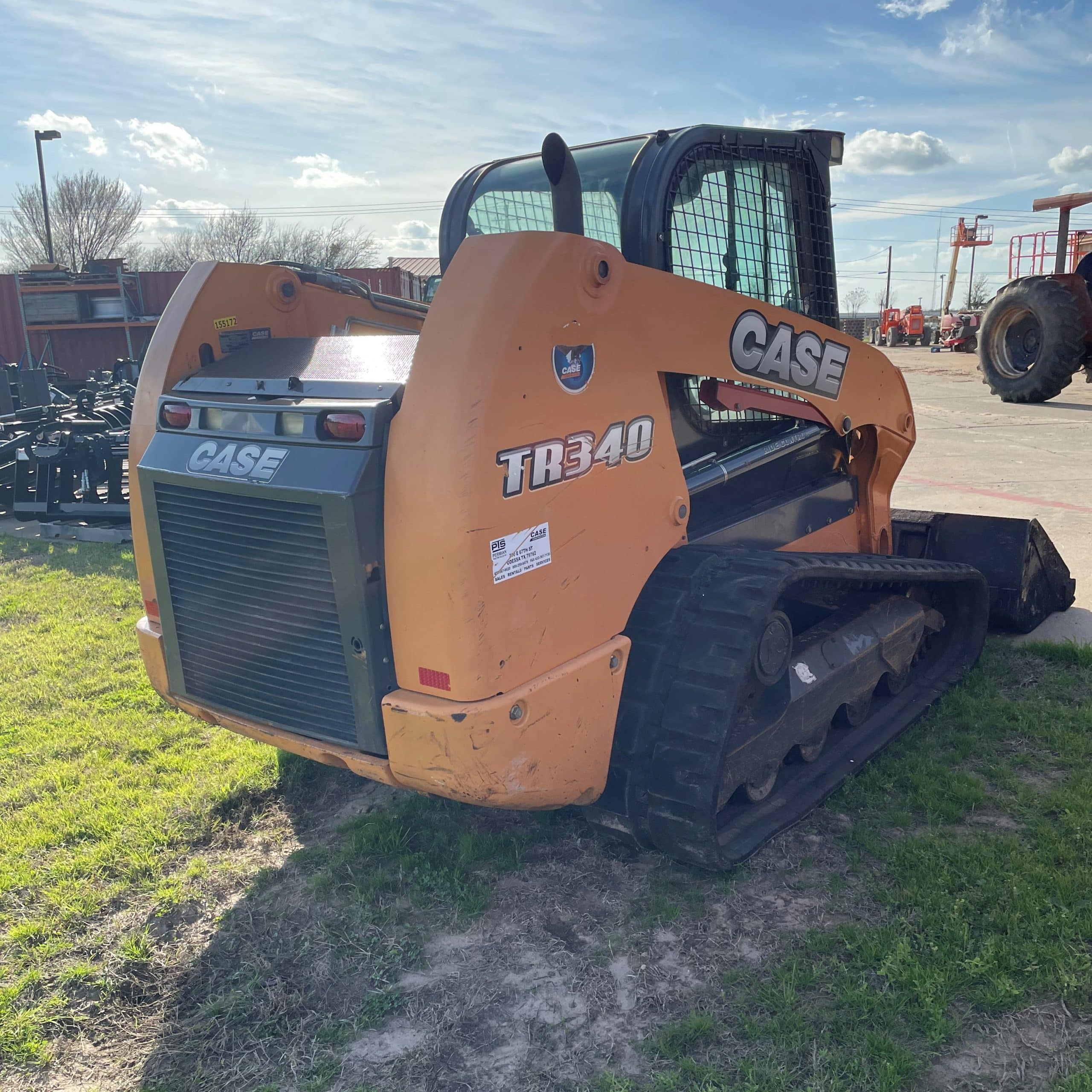 A Tractor Sitting In The Grass