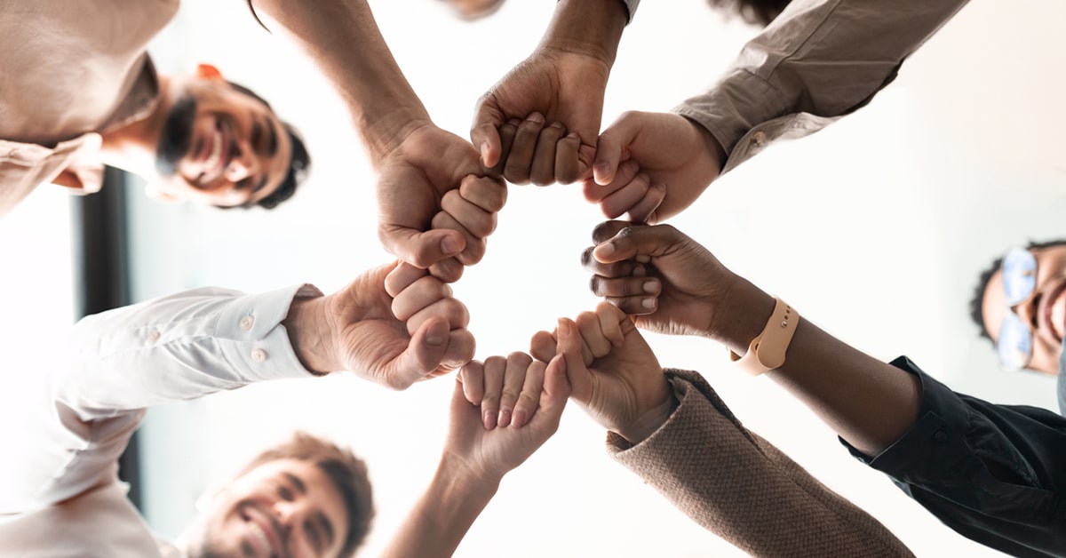 Teamwork, Power And Partnership - Workers doing fist pump while celebrating a good job